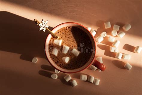 Hot Chocolate With Marshmallows And Snowflake Spoon In Pink Mug Stock