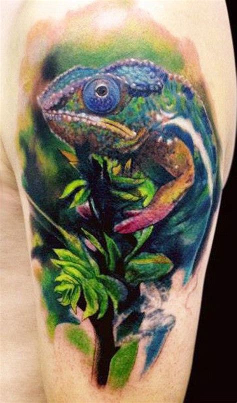 Wonderful Colored Chameleon Sitting On Tree Branch Tattoo On Upper Arm