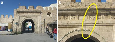 Slightly damaged arch of the southern gate to the medina, Monastir. a ...