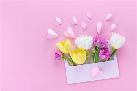 Envelope With Spring Tulip Flowers Decorated Paper Hearts On Pink Background For Mothers Day