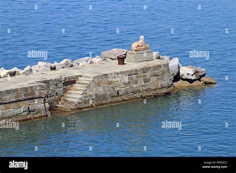 Stone Dock With Sphinx Statue Near Trieste Stock Photo Alamy