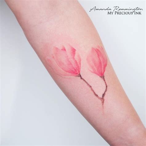 A Woman S Arm With Three Pink Flowers On It