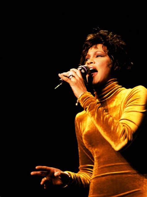 Whitney Houston wearing a gorgeous yellow velvet dress by her favorite ...