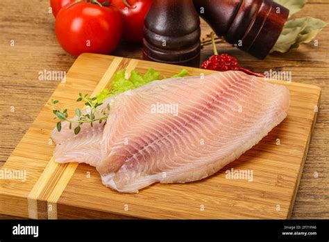 Raw Tilapia Fish Fillet For Cooking Stock Photo Alamy