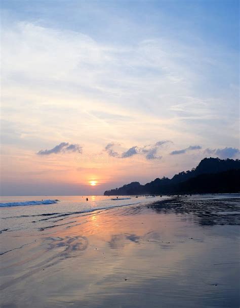 Golden Sunset With Reflection In Sea Water With Blue Sky At Radhanagar