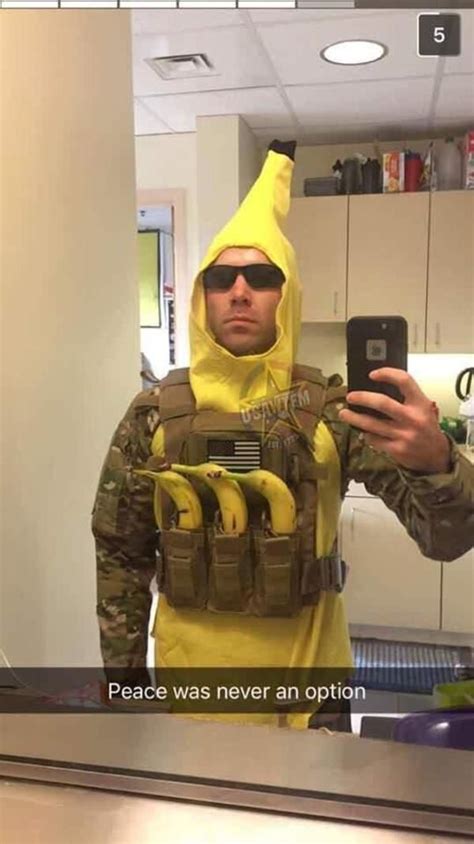 A Man In A Banana Suit Is Taking A Selfie With His Cell Phone And