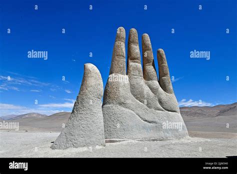 A Beautiful Shot Of A Sculpture Hand Located In The Atacama Desert In