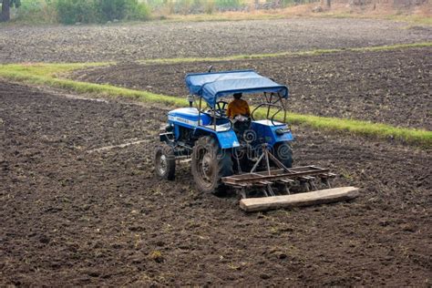 Indian Farmer Working With Tractor In Agriculture Field Editorial