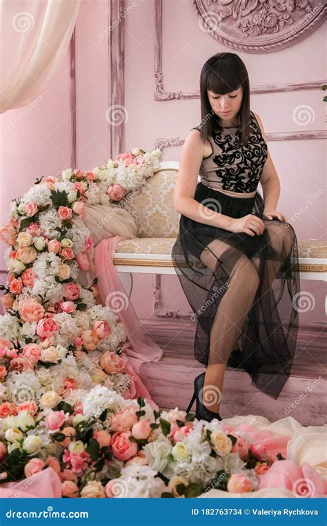 Beautiful Brunette Girl Sits Among Of Flowers Stock Photo Image Of Cute Model
