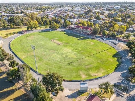 Image Of Aerial View Of A Road Surrounding A Football Oval And