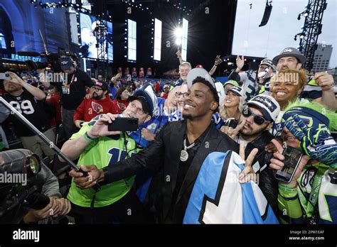 Illinois Cornerback Devon Witherspoon Poses With Seattle Seahawks Fans After Being Selected As