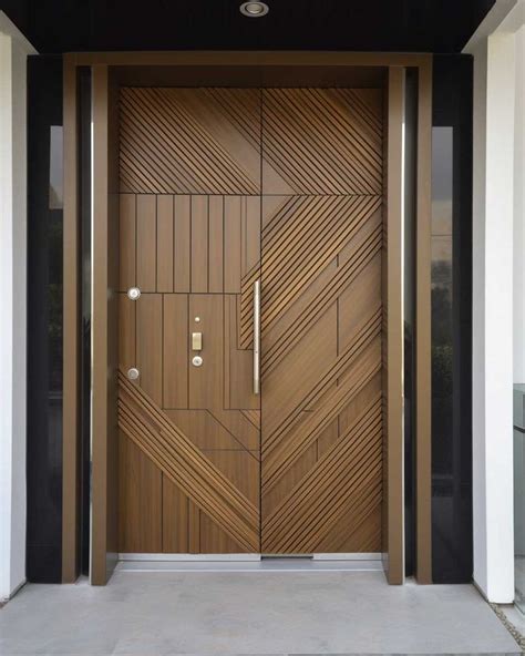 An Entrance With Wooden Doors And Metal Handles