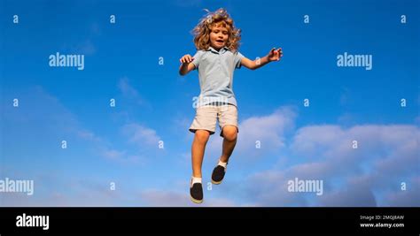 caucasian boy   park running  smiling  blue sky happy kid