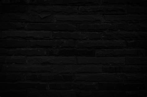 Old Black Brick Wall Texture For Background With Copy Space For Design