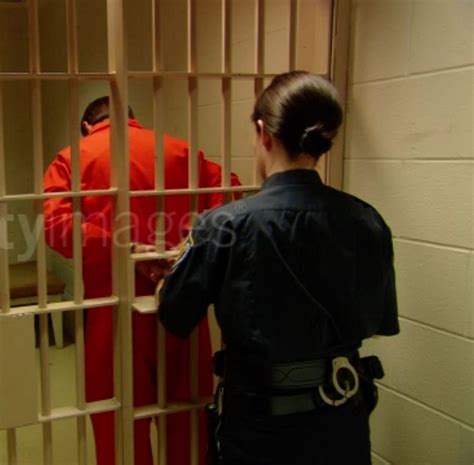 Women Officers Handcuffing Men