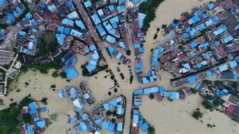 China floods wreak havoc, block roads and railways; more rain due