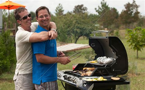 Gay Men Being Affectionate While Grilling Outdoors Rob Lang Images