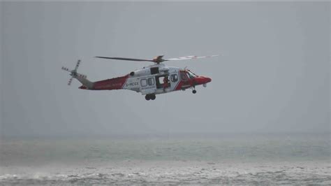 Coastguard Helicopter Exercise Extract Person From Sea Limeslade Bay