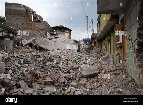 Ruins of buildings in a street in central Muzaffarabad, Pakistan ...