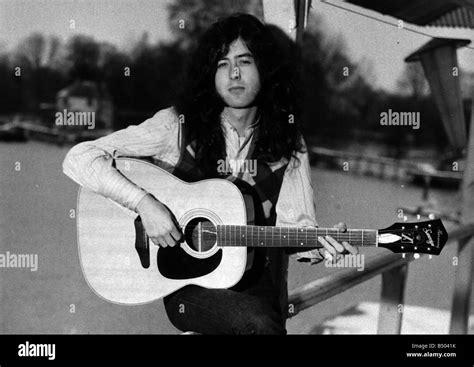 Jimmy Page Guitarist Led Zeppelin playing acoustic guitar Stock Photo ...