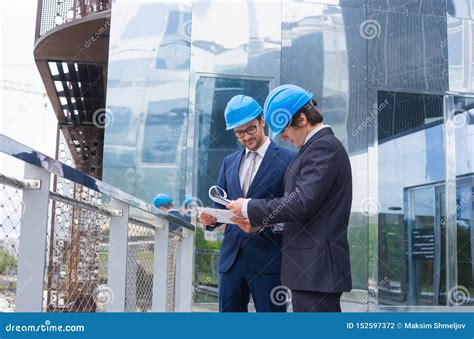 Real Estate Developers In Helmets New Office Construction Stock Photo