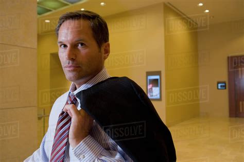 Businessman Holding Suit Jacket Over Shoulder Stock Photo Dissolve