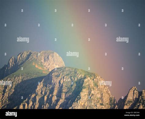 Rainbow Over Mountain Stock Photo - Alamy