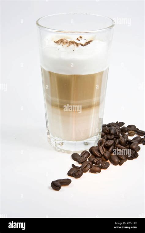 Latte macchiato, coffee beans Stock Photo - Alamy