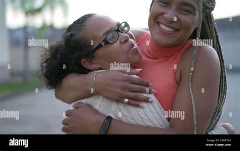 Brazilian Adult Daughter Hugging Senior Mother Showing Love And