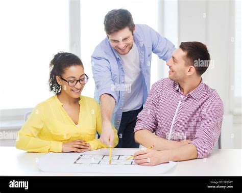 Three Smiling Architects Working In Office Stock Photo Alamy