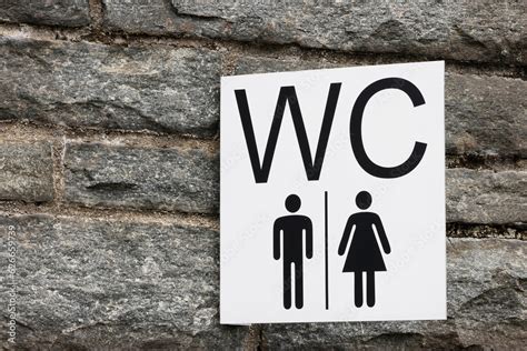 Female Male Restroom Sex Symbol On Red Brick Wall And White Brick As