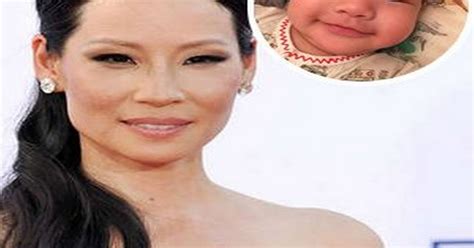 Lucy Liu S Three Month Old Son Rockwell Beams For The Camera In Super