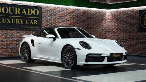 Porsche 911 Turbo S Cabriolet in white - Dourado Luxury Cars