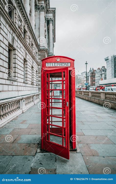 An Iconic Red Telephone Box Next To A Red Post Box In St Katharine