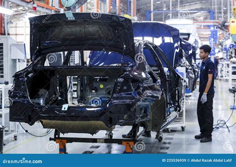 Automobile Workers Repairing Hydraulic Engine At Workshop In India Dec