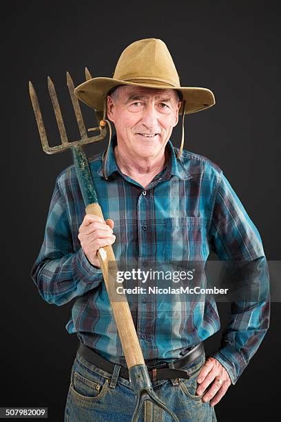 Guy Holding Pitchfork Photos And Premium High Res Pictures Getty Images