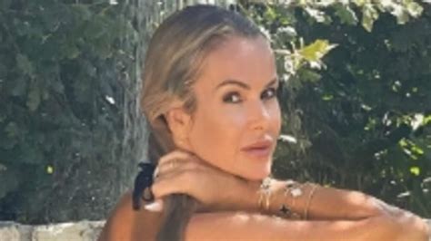 Amanda Holden Showcases Her Age Defying Physique In A TINY Black Bikini As She Sizzles In