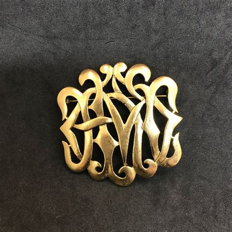 M Jent Gold Monogram Style Brooch Intertwined Ribbon Gothic Style