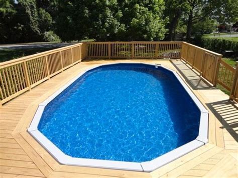 an above ground pool surrounded by wooden decking