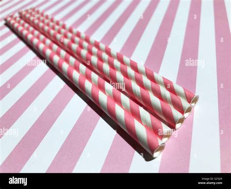 Pink and white striped paper straws Stock Photo - Alamy