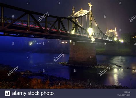 Night view of the Salzach Bridge, that was inaugurated in 1903, in ...