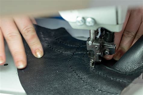 The Process Of Sewing Shoes On A Sewing Machine Shoe Production Stock