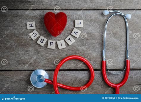 Hospital Text Word Made With Wood Blocks And Red Heartstethoscope On