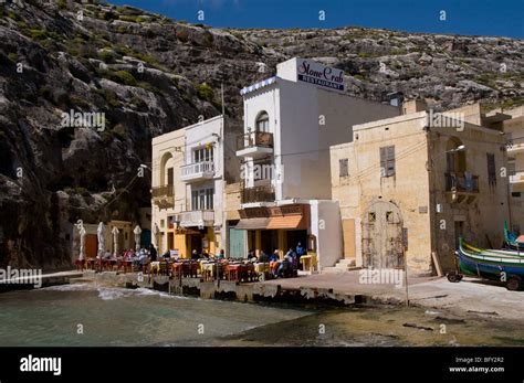 Waterside restaurants and boathouse at Xlendi Bay, Gozo Stock Photo - Alamy