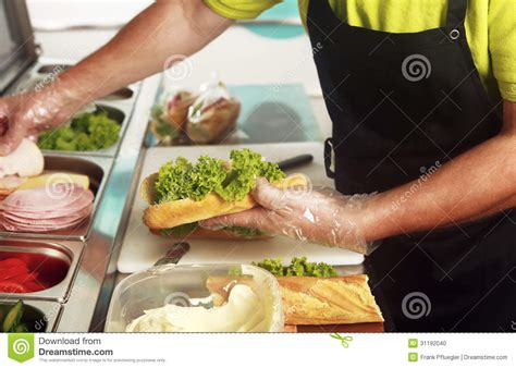 A Chef Preparing A Sandwich With Fresh Salad Stock Photo Image Of