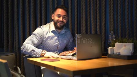 Businessman With Shirt Talking And Smiling While Sitting On A