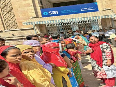 Women Queue In The Sun Before The Bank Opens To Open An Account