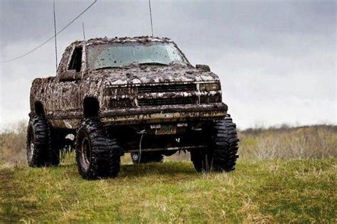 Muddy Jacked Up Chevy Trucks