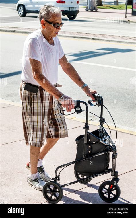 Miami Beach Florida Senior Seniors Citizen Citizens Man Men Male Hispanic Walker Walking