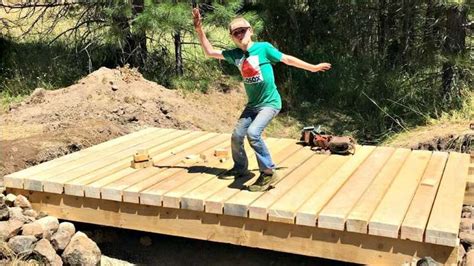 Beautiful Building A Wooden Bridge Over A Creek Collection Tr Dg Rd